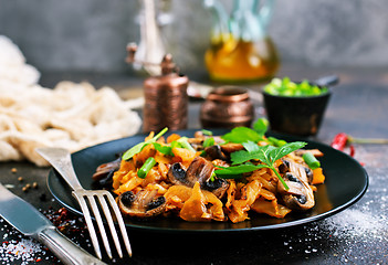 Image showing Fried mushrooms and cabbage