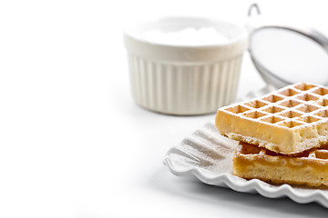 Image showing Belgium waffers with sugar powder on ceramic plate and strainer 