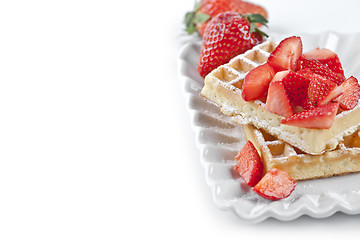 Image showing Belgium waffers with sugar powder and strawberries on ceramic pl