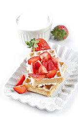 Image showing Belgium waffers with sugar powder and strawberries on ceramic pl