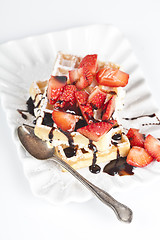 Image showing Belgium waffers with sugar powder, strawberries and chocolate on