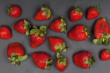 Image showing Fresh ripe strawberries on black background.