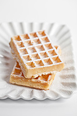 Image showing Belgium waffers with sugar powder on ceramic plate isolated on w