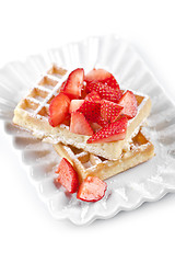 Image showing Belgium waffers with sugar powder and strawberries on ceramic pl