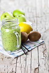 Image showing Green smoothie with kiwi, apple, lemon and chia seeds. Healthy f