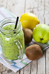 Image showing Green smoothie with kiwi, apple, lemon and chia seeds. Healthy f