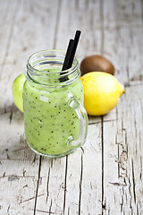 Image showing Green smoothie with kiwi, apple, lemon and chia seeds. Healthy f