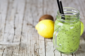 Image showing Green smoothie with kiwi, apple, lemon and chia seeds. Healthy f