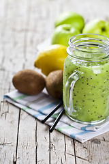 Image showing Green smoothie with kiwi, apple, lemon and chia seeds. Healthy f