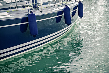 Image showing Blue motorboat reflecting in water