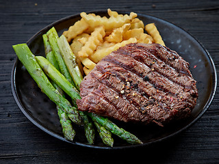 Image showing plate of grilled beef fillet steak meat and vegetables