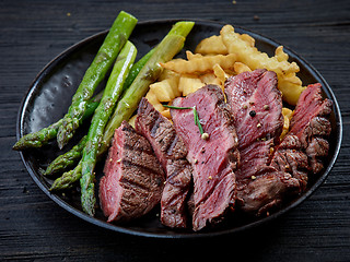 Image showing plate of grilled beef fillet steak and vegetables