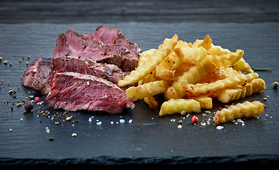 Image showing grilled beef fillet steak and fried potatoes