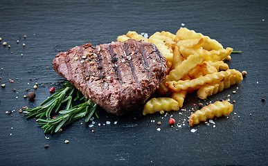 Image showing grilled beef fillet steak and fried potatoes