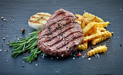 Image showing grilled beef fillet steak and fried potatoes