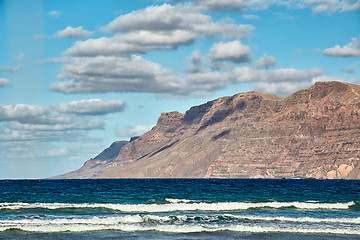 Image showing Landscape with volcanic hills and atlantic ocean in Lanzarote 