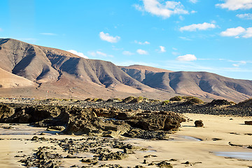 Image showing Volcanic hills and blue sky