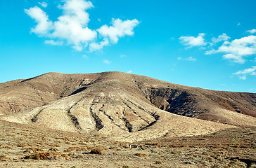 Image showing Volcanic hills and blue sky