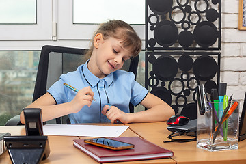 Image showing Eight-year-old girl rejoices after signing another document