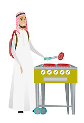 Image showing Traveler man cooking steak on barbecue grill.