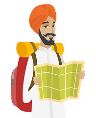 Image showing Hindu traveler with backpack looking at map.