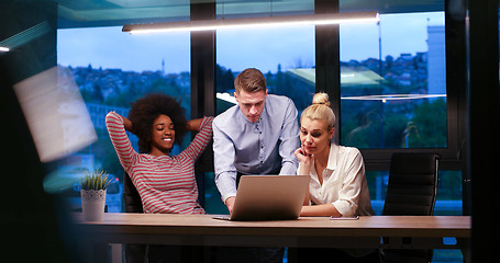 Image showing Multiethnic startup business team in night office