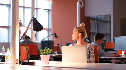 Image showing businesswoman using a laptop in startup office