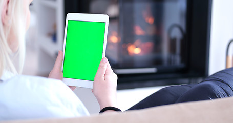 Image showing woman on sofa using tablet computer