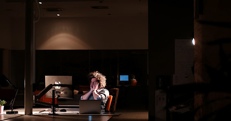 Image showing businessman relaxing at the desk