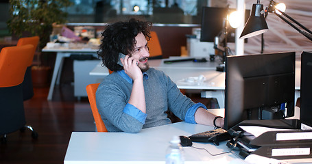 Image showing businessman working using a computer in startup office