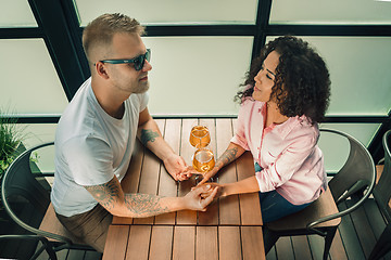 Image showing She said him yes. Closeup of young man kissing his wife hand while making marriage proposal outdoors.