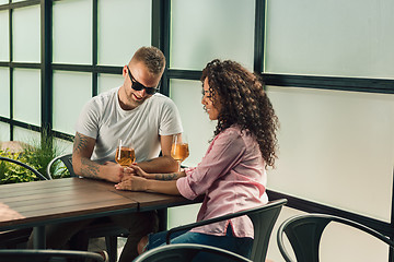 Image showing Cheerful couple in cafe having a good time.