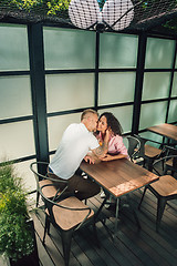 Image showing Cheerful couple in cafe having a good time.