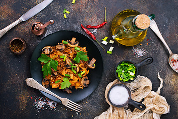 Image showing Fried mushrooms and cabbage