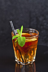 Image showing Traditional fresh iced tea with lemon, mint leaves and ice cubes