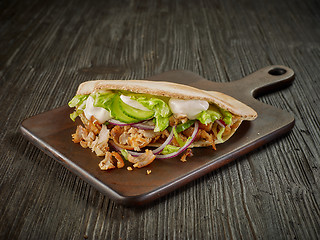 Image showing doner kebab on wooden table