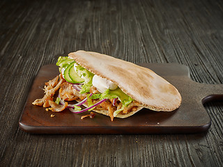 Image showing doner kebab on wooden table