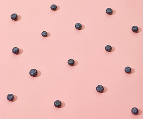 Image showing blueberries on pink background