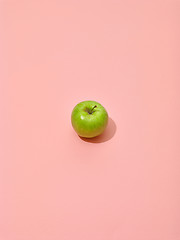 Image showing green apple on pink background