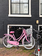 Image showing  Pink bicycle on the street of Amsterdam