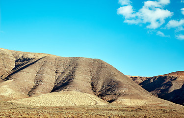 Image showing Volcanic hills and blue sky