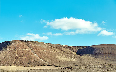 Image showing Volcanic hills and blue sky