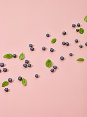 Image showing blueberries and green basil leaves