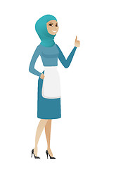 Image showing Young muslim cleaner giving thumb up.