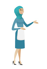 Image showing Young muslim happy cleaner gesturing.