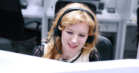 Image showing female call centre operator doing her job