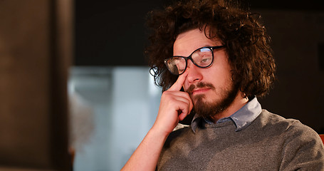 Image showing man working on computer in dark office