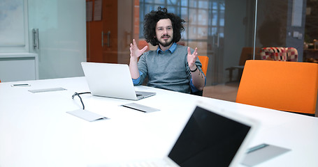 Image showing businessman working using a laptop in startup office