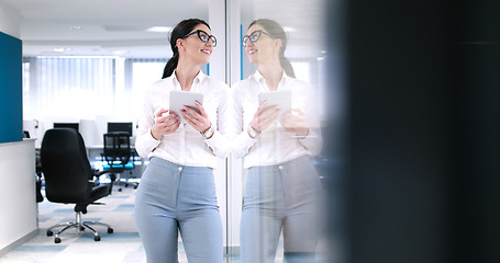 Image showing Business Woman Using Digital Tablet in front of Office