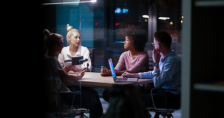 Image showing Multiethnic startup business team in night office